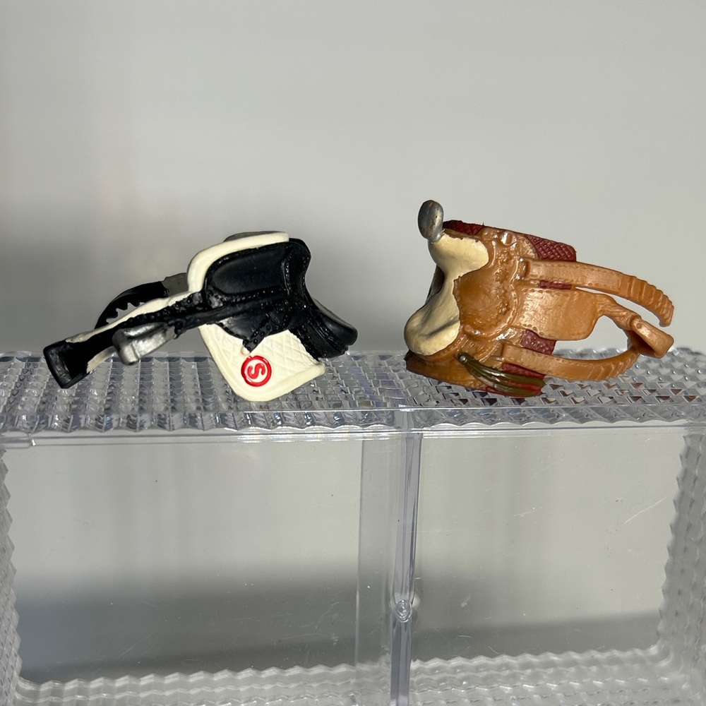 Pair of Schleich Saddles